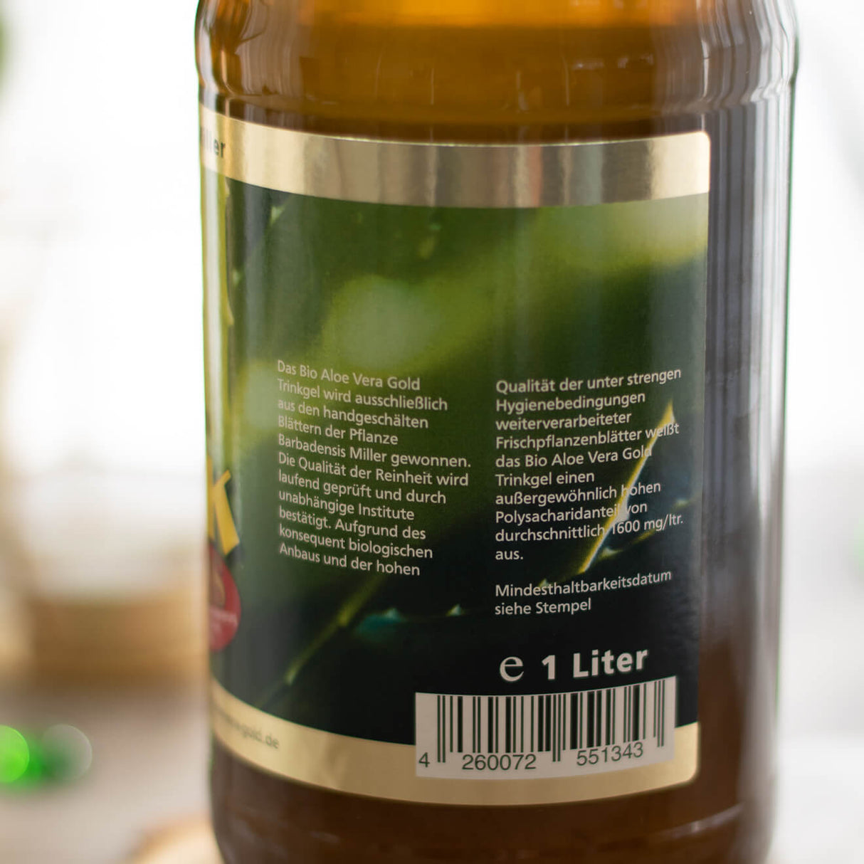 Herstellungs- und Qualitätshinweise auf der Seite der Aloe Vera Gold Trinkgel PLUS Flasche